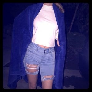 Ripped shorts and white neck shirt